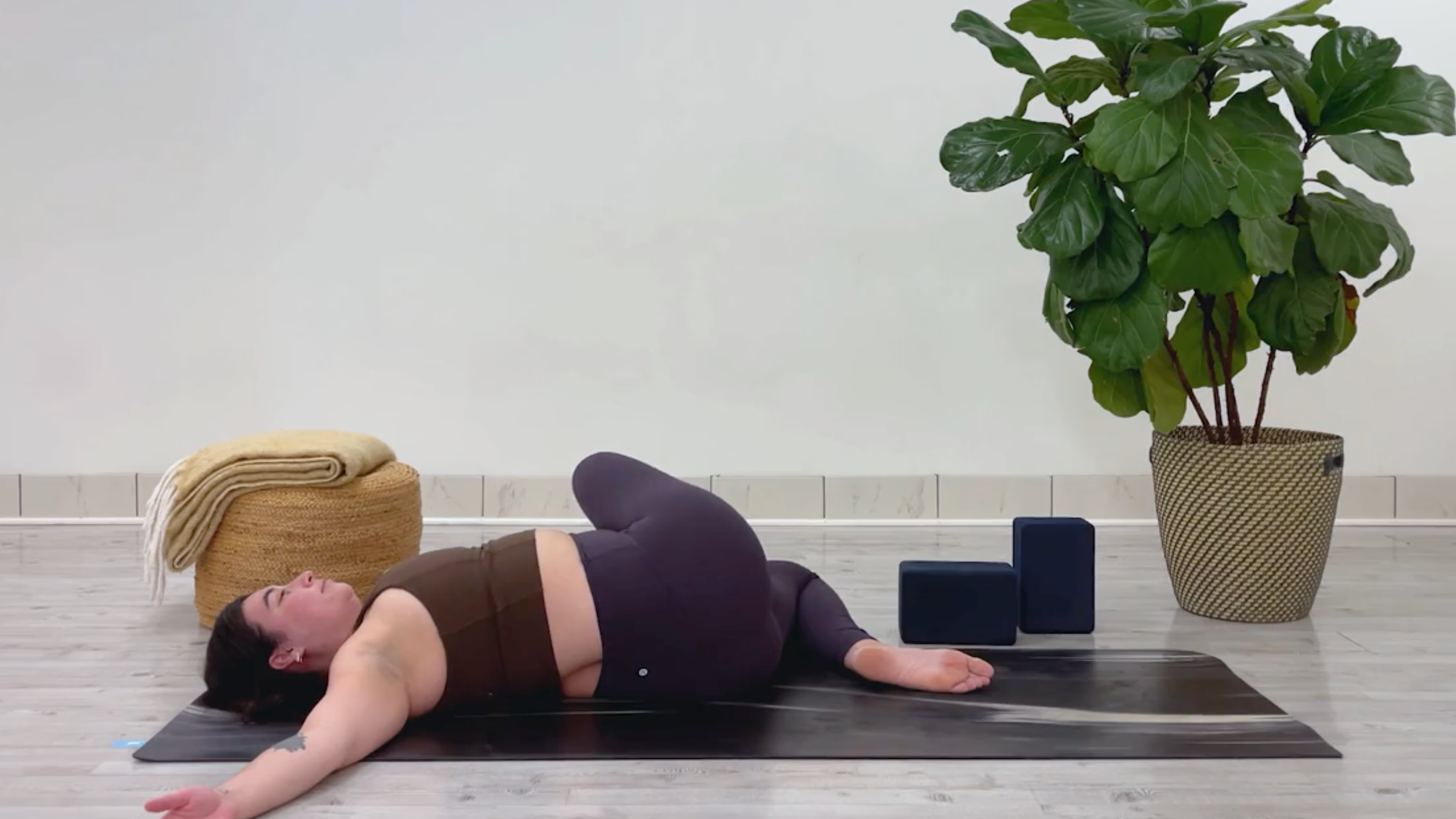 Yoga teacher Taylor Lorenz in Reclining Twist